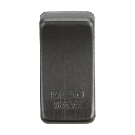 A close-up of a single switch cover named "Marked MICROWAVE" in smoked bronze, designed with an ABS construction. The cover features a textured surface and has a rectangular shape, positioned vertically in the image.