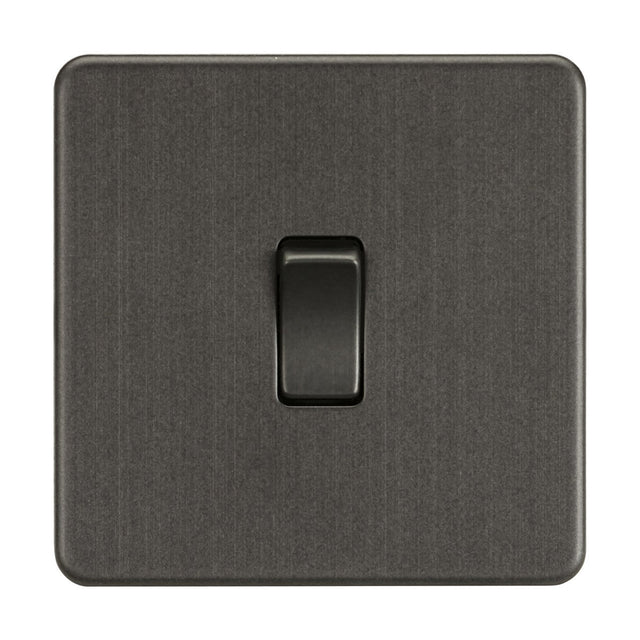 A 10AX 1 Gang Intermediate Switch, in smoked bronze on a brushed metal plate, is centered in the image. Its sleek, modern design complements transitional interiors.