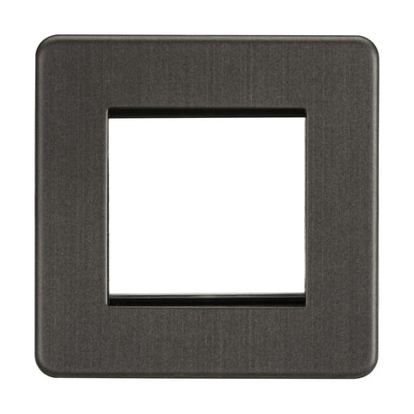 The 2 Gang Modular Faceplate - Smoked Bronze (Screwless) is a square cover with a central rectangular cutout for one switch, featuring a smooth matte finish and rounded edges.