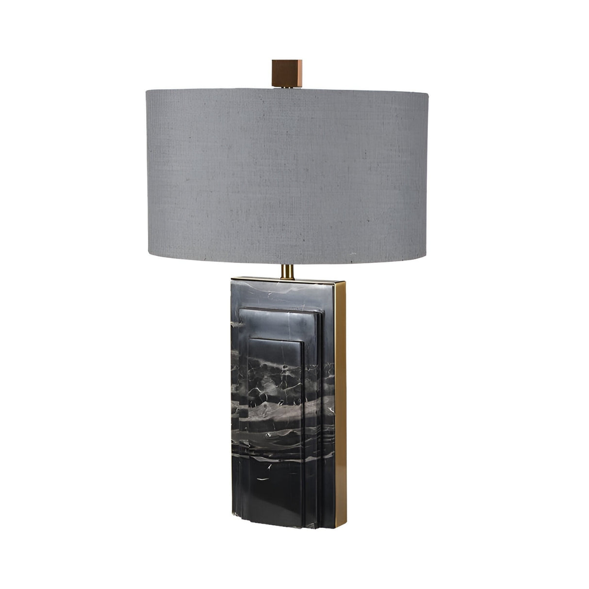 The Caldrin 1 Light Marble Table Lamp - Brass & Black features a modern rectangular black and gray marble base with brass accents and a large cylindrical gray fabric shade, beautifully set against a white background.