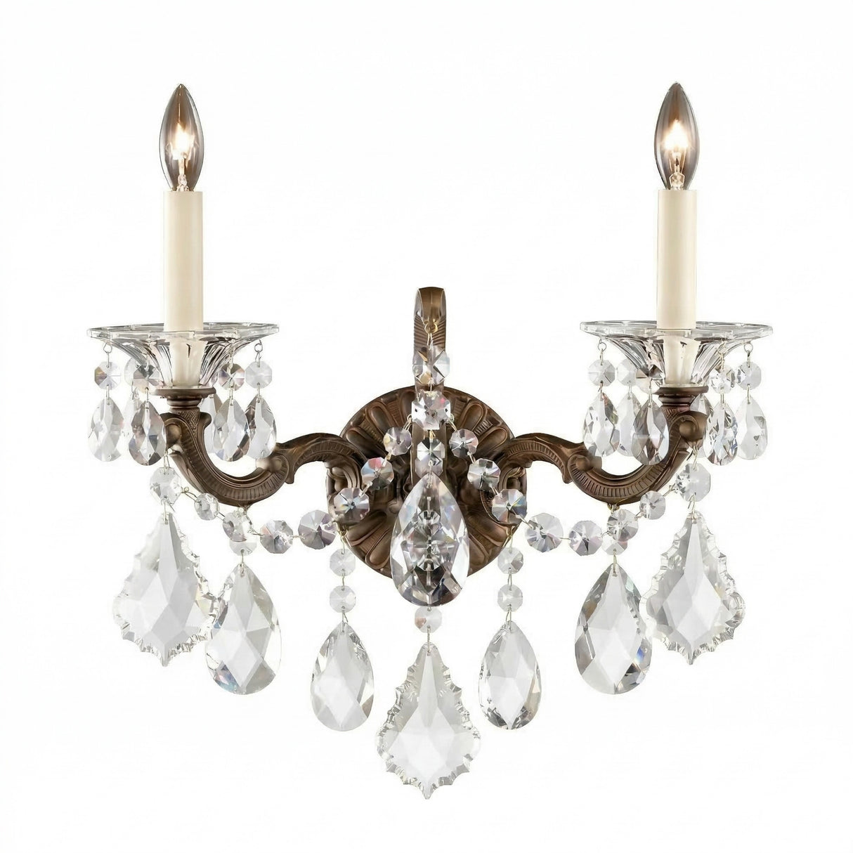 The Vienna 2 Light K9 Crystal Wall Light features two candle-style bulbs, ornate bronze arms, and hanging K9 crystal pendants for a luxurious Rococo accent that adds elegance and sparkling light to any space.