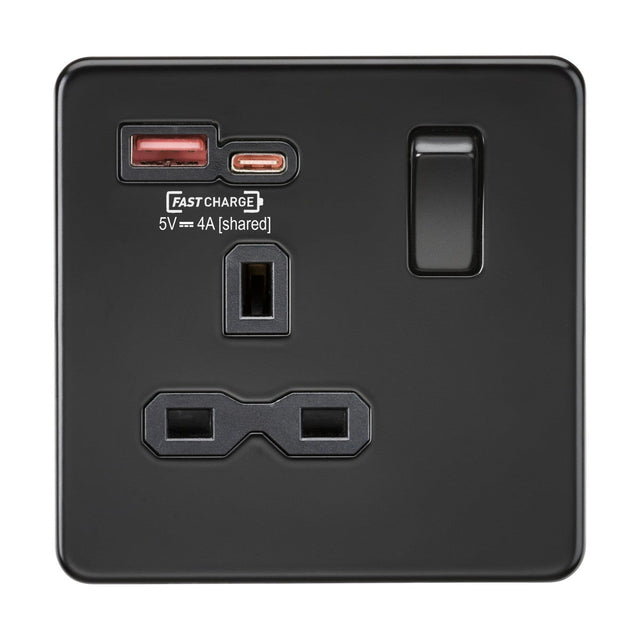 Presenting the 13A 1 Gang SP Switched Socket in Matt Black with a sleek screwless design and black insert. This socket features dual USB ports—one Type-A and one Type-C—with a shared FASTCHARGE output of 5V ⎓ 4A. It includes a standard power switch, a three-pronged outlet, and is rated for Over Voltage Category III.