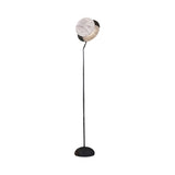The Selvano 1 Light Globe Alabaster Floor Lamp features a sleek matte black stand and a soft white globe shade, resembling a moon, set against a plain white background.
