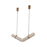 Zareon Small LED chandelier with angled alabaster cylinders joined by brushed brass cuffs, suspended on twin black cables against a plain white background.