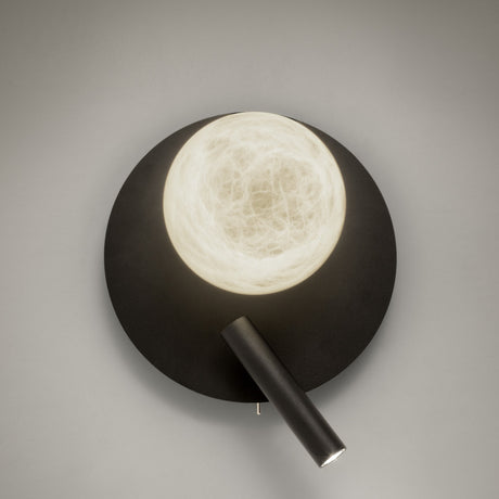 Halvessa LED Alabaster Wall Light in black, with a round textured iron plate, glowing alabaster globe, and angled reading light arm on a plain grey background.