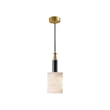 The Bellaro 1 Light Small Textured Column Alabaster Single Pendant Light features a soft white cylindrical shade with wavy edges, suspended by a black cord from a round brass mount with elegant black and gold accents.