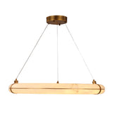 Aureon LED 1m alabaster ring chandelier, elongated oval alabaster tube pendant with brushed brass brackets and round ceiling canopy, suspended on cables against a plain white background.