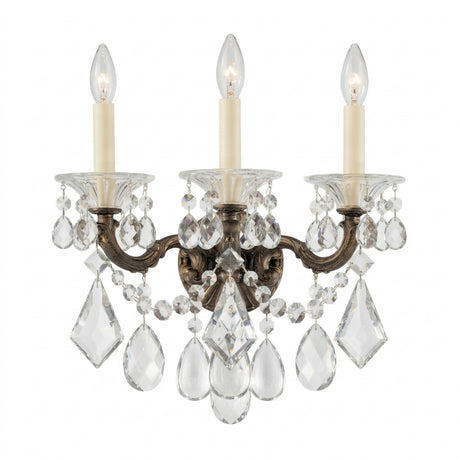 The Vienna 3 Light K9 Crystal Wall Light features three ornate brass arms, candle-style bulbs, and clear K9 crystal prisms and beads, all displayed against a white background.