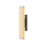 The Selvara LED Medium Alabaster Double Wall Light in Matte Black & Soft White features a vertical, cylindrical design with a frosted diffuser and dark rectangular mount—ideal for elegant modern accent lighting on white walls.