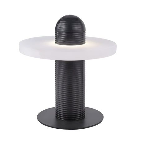 The Nyxara LED Single Tiered Alabaster Disc Table Lamp features a ribbed black cylindrical base, a round flat alabaster shade, and a matching dome, emitting soft white light for stylish ambiance.