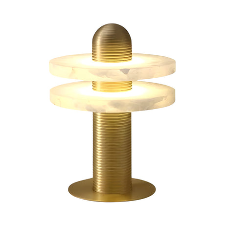 The Nyxara LED Double Tiered Alabaster Table Lamp features a gold brass base and two glowing alabaster rings, separated by a rounded brass cap, offering sleek contemporary style and warm soft white light.