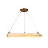 Aureon LED Alabaster Circular Chandelier 600mm in Brushed Brass, a linear ring pendant light suspended on steel cables from a round ceiling canopy, shown lit against a plain white background.