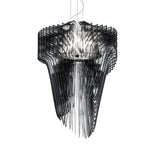 The Aeris 5 Light Large Chandelier in Black features sculptural, layered panels surrounding central bulbs, creating a striking symmetrical design suspended by thin wires—ideal modern lighting for contemporary dining rooms.