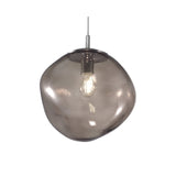 Saxa 15cm Glass Pendant Light with a single organic, pebble-shaped smoked grey glass shade and chrome ceiling mount, shown lit against a plain white background.