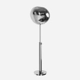 The Lava Floor Lamp - Silver is a contemporary lighting piece with an organic design, boasting a sleek chrome finish. It features a large, uniquely shaped shade atop a slim, straight stand mounted on a round base. This lamp offers minimalist appeal with subtle molten effects adding to its allure.