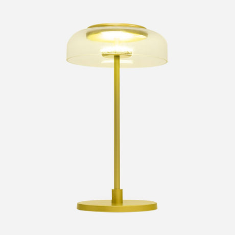The Blossom LED Glass Table Lamp - Gold features a gold-finished base and stem, accented by a handcrafted glass shade that creates a translucent, dome-shaped yellow cover. When illuminated, it projects a warm glow against the plain white background.