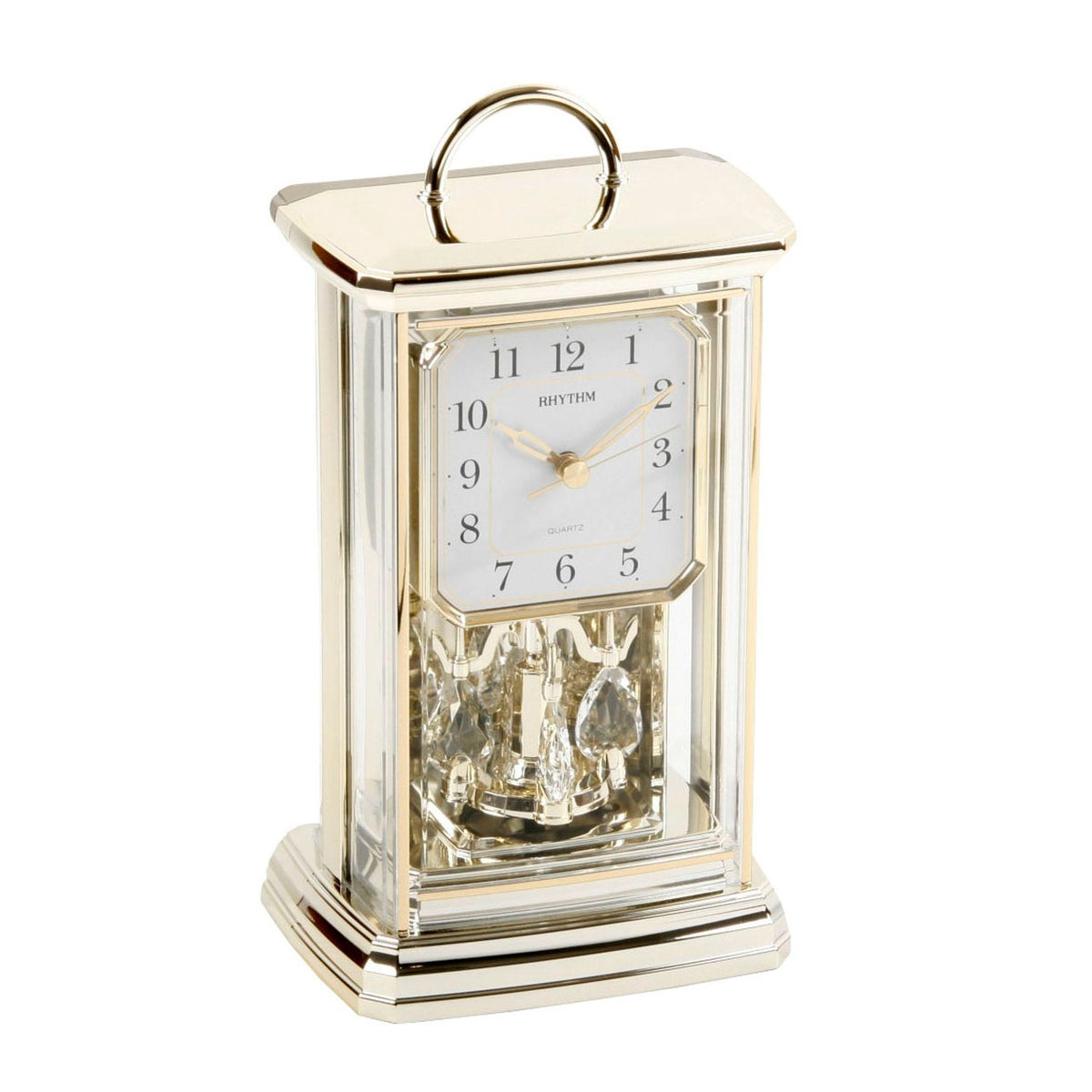 Oblong mantel clock with gold-tone plastic case, curved top handle, clear side panels, white Arabic dial and decorative crystal-drop pendulum, shown on a plain background.
