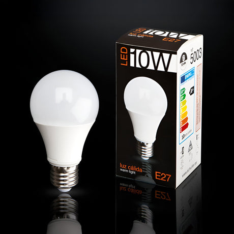 Schuller LED globe bulb 10W E27 with white opal finish beside its black and orange printed retail box on a reflective black background.