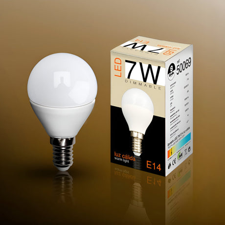Schuller dimmable 7W E14 LED opal mini globe bulb in warm white beside its printed retail box on a gold-toned background.
