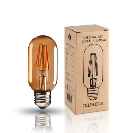 Schuller Vintage T45 LED bulb with amber glass, visible inner filaments and E27 base, shown beside its kraft product box on a white background.