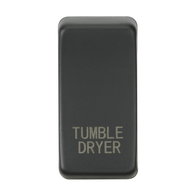 An anthracite-finished switch cover, rectangular with rounded edges and labeled "TUMBLE DRYER" in light lettering, is centered against a white background.