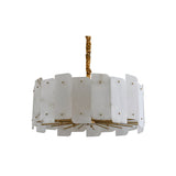 The Caldrin 6 Light Tiered Panel Alabaster Chandelier in Soft White & Brass features a circular frame with overlapping white rectangular panels and brass accents, suspended by a wrapped gold stem against a white background.