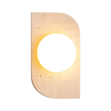 The Virella 1 Light Vertical Travertine Wall Light in light beige features a rectangular shape with rounded edges and a central circular cutout, emitting warm ambient light that softly glows around the inner edge.