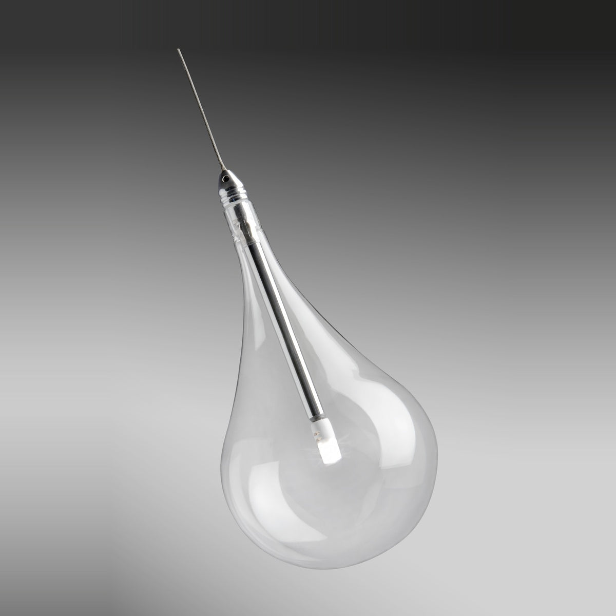 Yarvelle Glass Pendant Light in Chrome, a clear teardrop glass shade with a slim chrome stem and cable suspension, shown against a plain grey background.