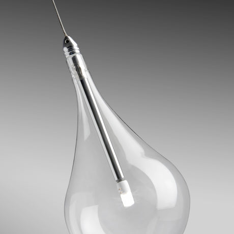 Close-up of a Yarvelle teardrop glass pendant shade with slim chrome stem and small internal LED lamp, suspended on a cable against a grey background.