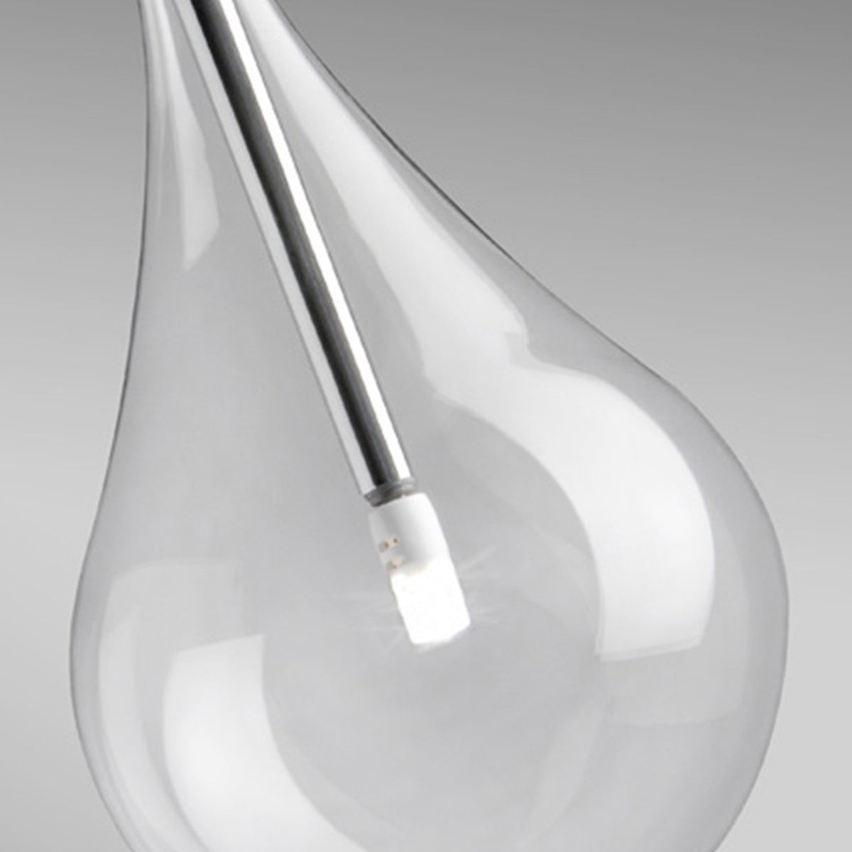 Close-up of a Yarvelle pendant light clear glass teardrop shade with internal chrome stem and small lamp, set against a light grey background.