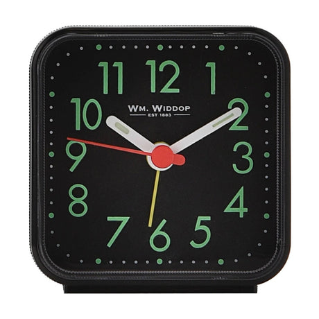 Square black plastic alarm clock with luminous dial, green Arabic numerals, white hour and minute hands, red and yellow accent hands, on a plain white background.