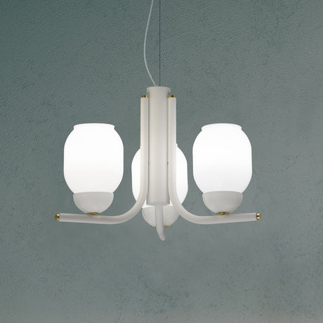 Faronne 3 Light Glass Chandelier in white, three opal glass barrel shades on curved iron arms with brass accents, shown against a muted teal background.