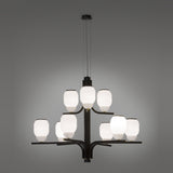 Faronne 9 Light Glass Chandelier in black iron with nine opal glass barrel shades arranged in two tiers on sweeping arms, shown against a plain grey background.