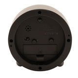 Rear view of the round Metal Case Alarm Clock in grey, showing battery compartment, ON/OFF switch, snooze and light dials, speaker holes, and CE marking on a plain background.