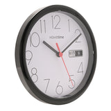 Round wall clock, 21.5cm, with a gloss black plastic case, white dial, black Arabic numerals, black hands, red second hand, and a day/date window, shown on a white background.