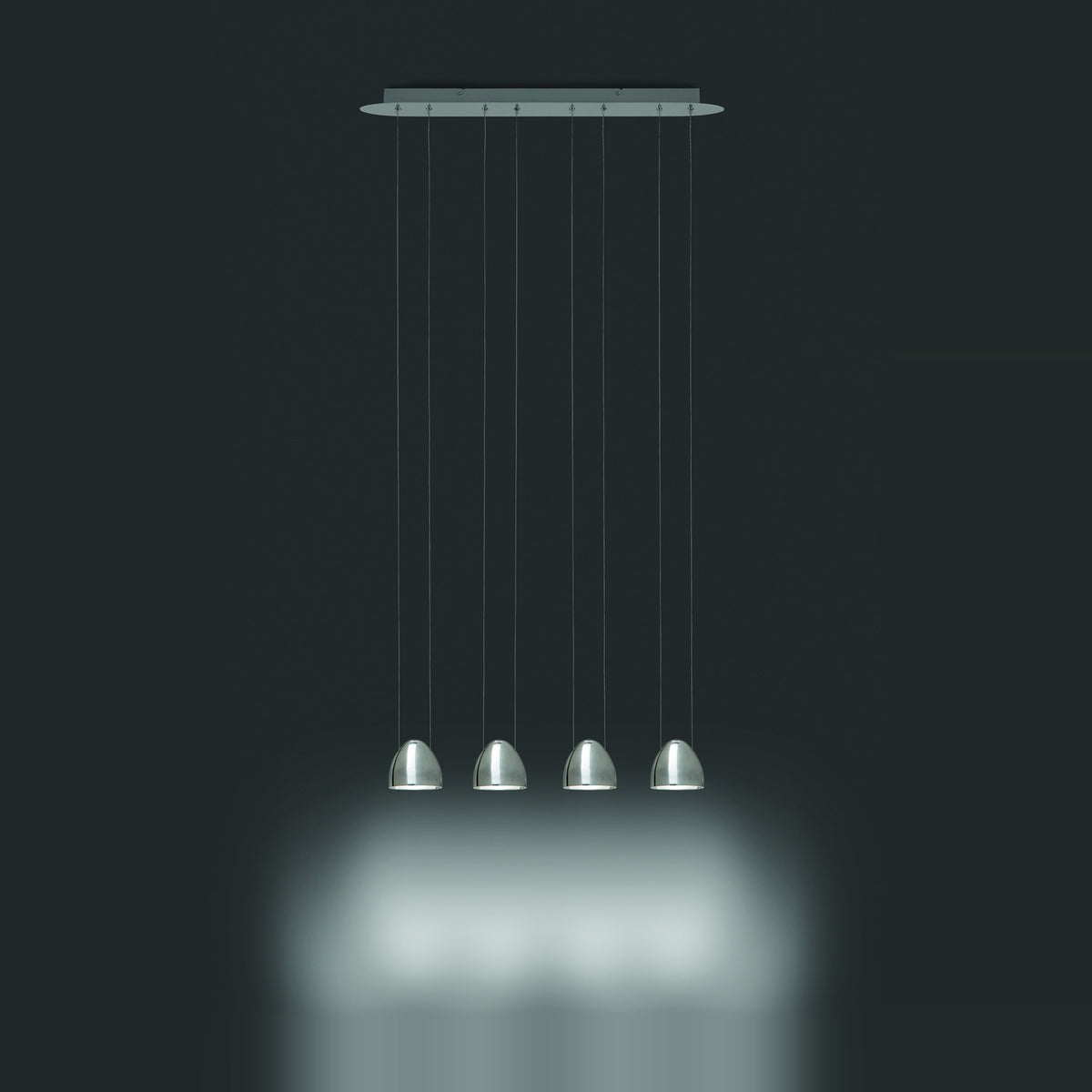 Rinvorne LED 4 Light Linear Pendant Light in chrome, four small egg-shaped shades on fine cables from a slim ceiling plate, shown against a dark background.