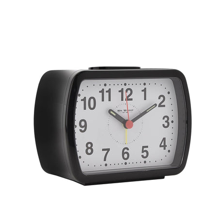 Oblong black plastic alarm clock with rounded corners, white dial, bold Arabic numerals, luminous hour and minute hands, and red second hand, shown on a plain white background.