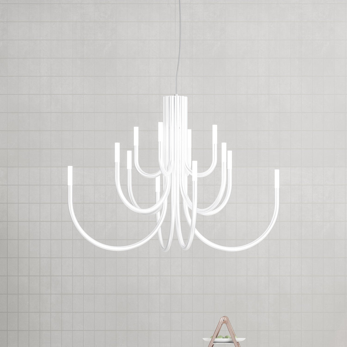 ThePalm LED 18 Light Chandelier in white, with slender arms curving outward from a fluted stem to glowing LED tips, shown against a light grey gridded wall.