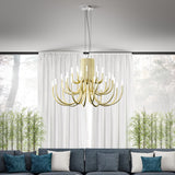 ThePalm LED 30 Light Chandelier in satin gold with curved tubular arms rising in tiers, shown above a grey sofa in a living room with sheer curtains.