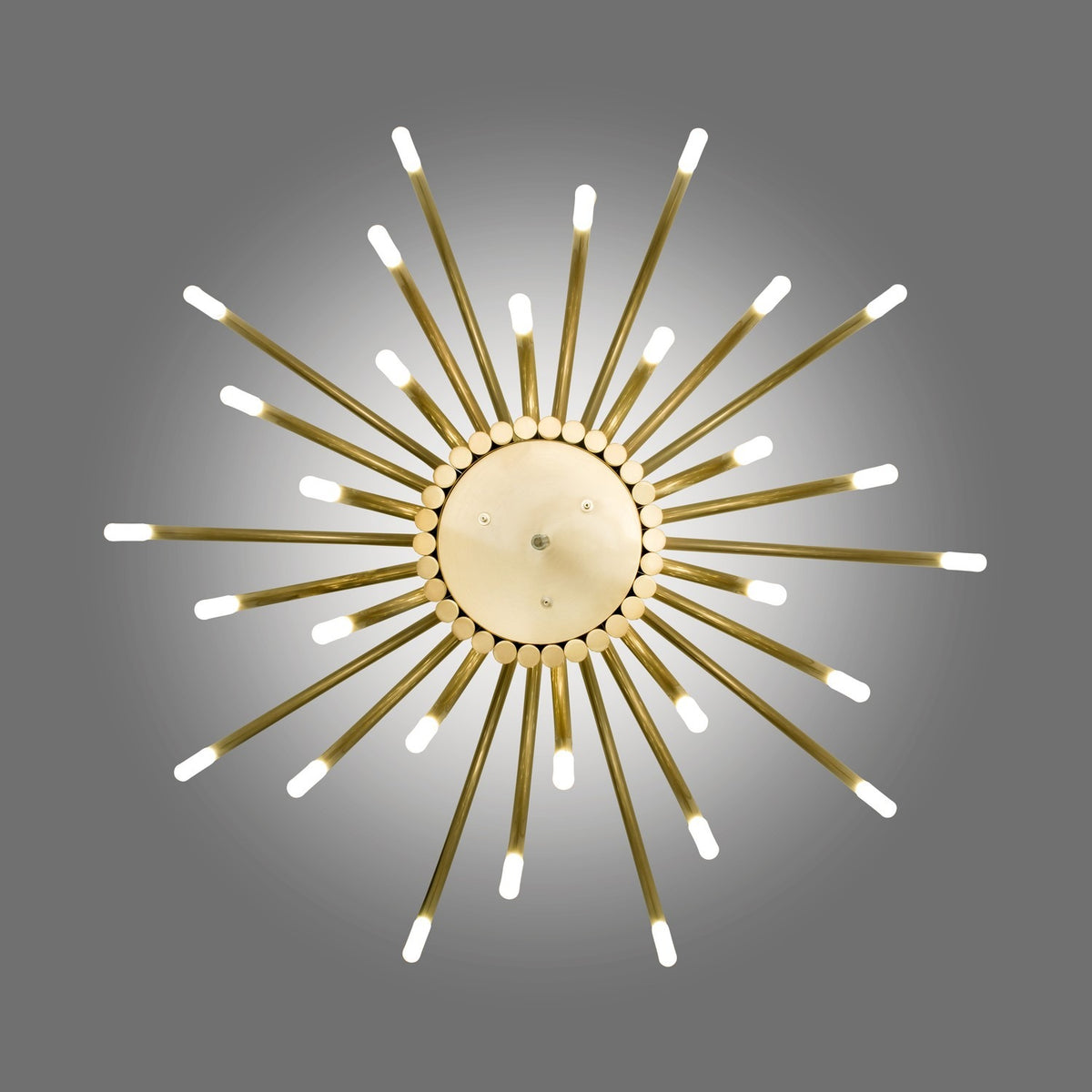 ThePalm LED 30 Light Chandelier in satin gold, sunburst design with tubular arms radiating from a central disc, each ending in a glowing warm white acrylic tip, shown on a grey background.