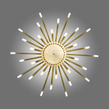 ThePalm LED 30 Light Chandelier in satin gold, sunburst design with tubular arms radiating from a central disc, each ending in a glowing warm white acrylic tip, shown on a grey background.