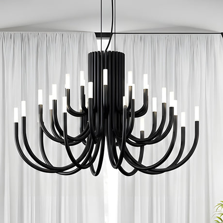 ThePalm LED 30 Light Chandelier in black, with curved iron arms rising in tiers from a fluted column, each tipped with glowing white acrylic, shown against sheer curtains.