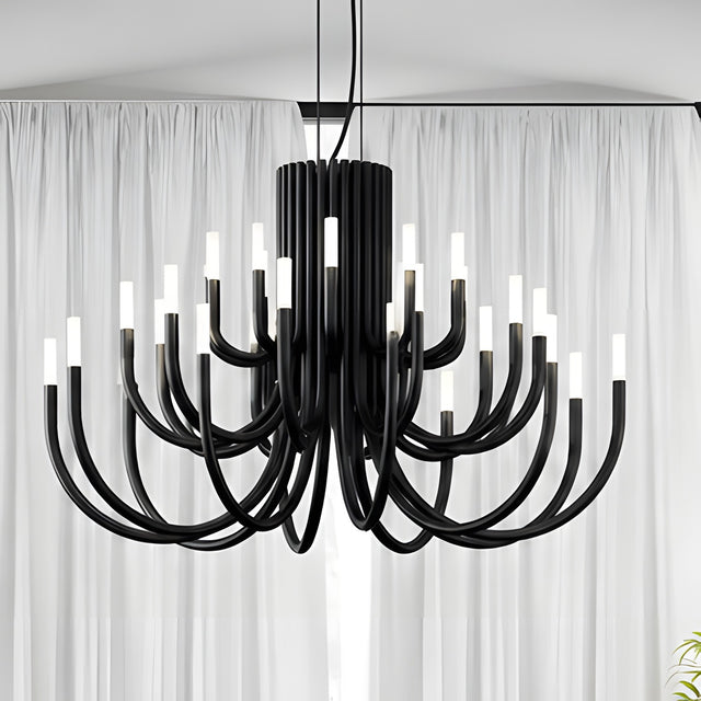 ThePalm LED 30 Light Chandelier in black, with curved iron arms rising in tiers from a fluted column, each tipped with glowing white acrylic, shown against sheer curtains.