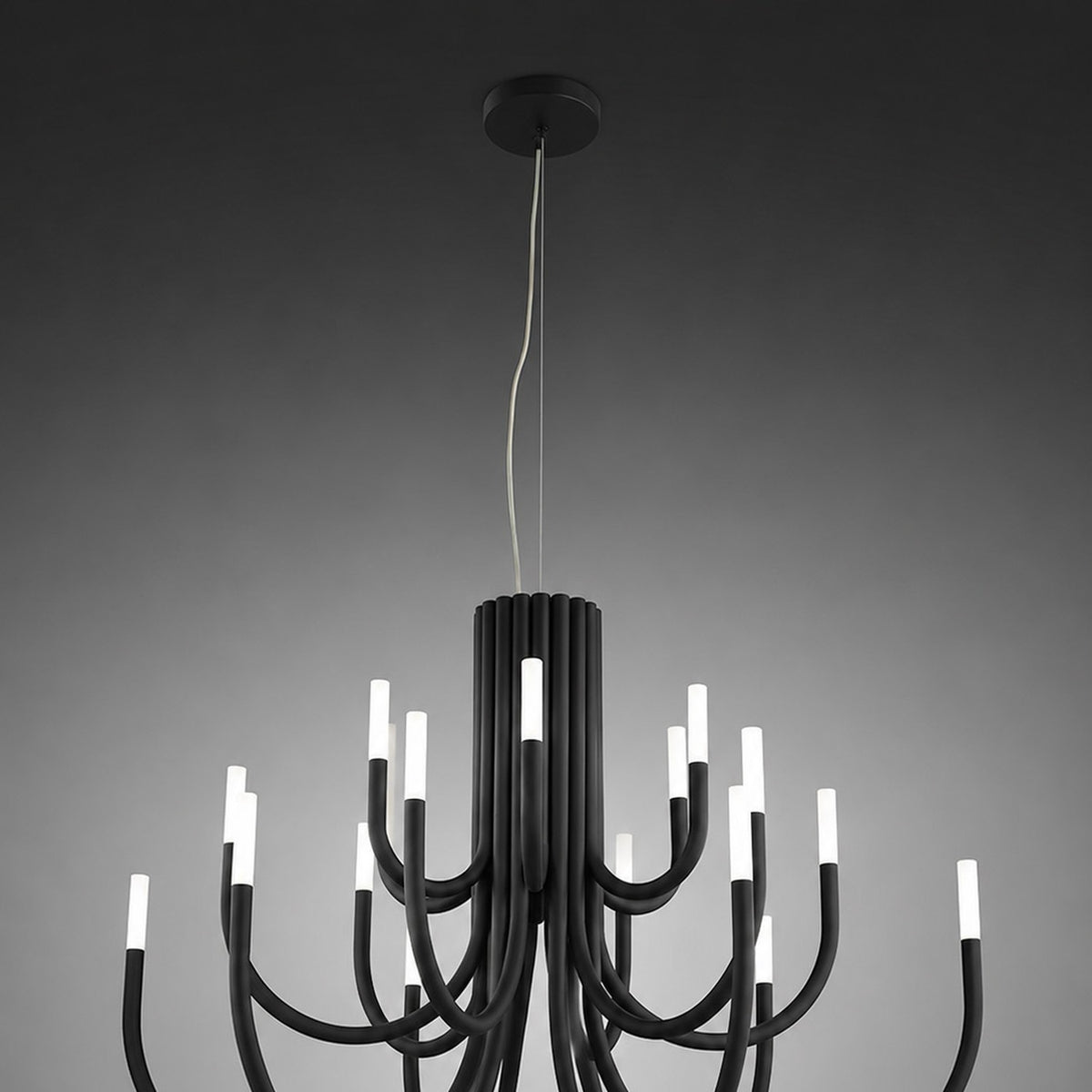 ThePalm LED 30 Light Chandelier in black, with curved iron arms rising in two tiers from a fluted column, each tipped with glowing white acrylic LED ends, shown against a grey background.