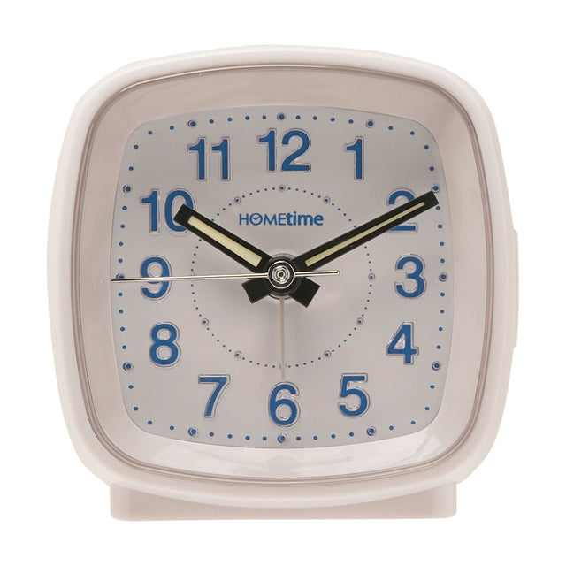 White square cushion alarm clock with rounded corners, plastic case, white dial, blue Arabic numerals, and black luminous hour and minute hands.