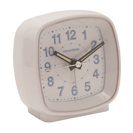 Square white plastic alarm clock with cushioned rounded corners, white dial, blue Arabic numerals, and black luminous hour and minute hands, shown on a plain background.
