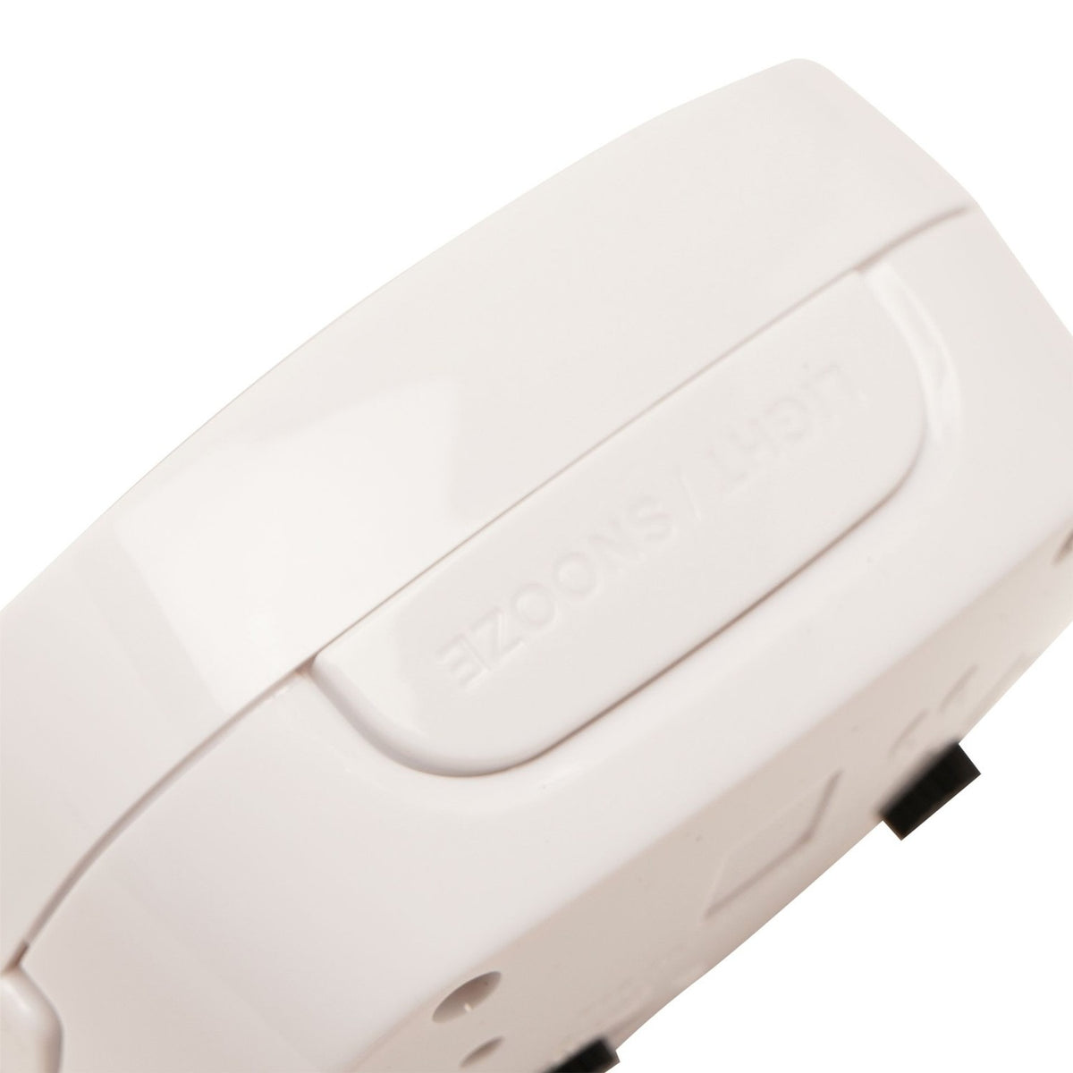 Close-up of the Cushion Silent Sweep Crescendo alarm clock in white plastic, showing the glossy rounded casing and Light/Snooze button, set against a plain white background.