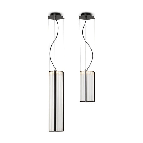 Pair of Kalvenne LED glass pendant lights in black, slim ribbed glass columns in fine iron frames, one tall and one short, suspended on thin cables against a plain white background.