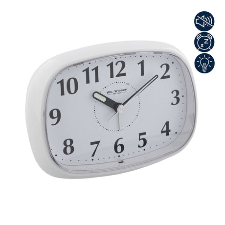 Oval white plastic alarm clock with black Arabic numerals, luminous hour and minute hands, and icons showing silent, snooze, and light functions on a plain background.
