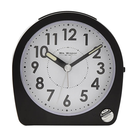 Arched black plastic alarm clock with white dial, bold black numerals, luminous hands, and volume dial, shown on a plain white background.